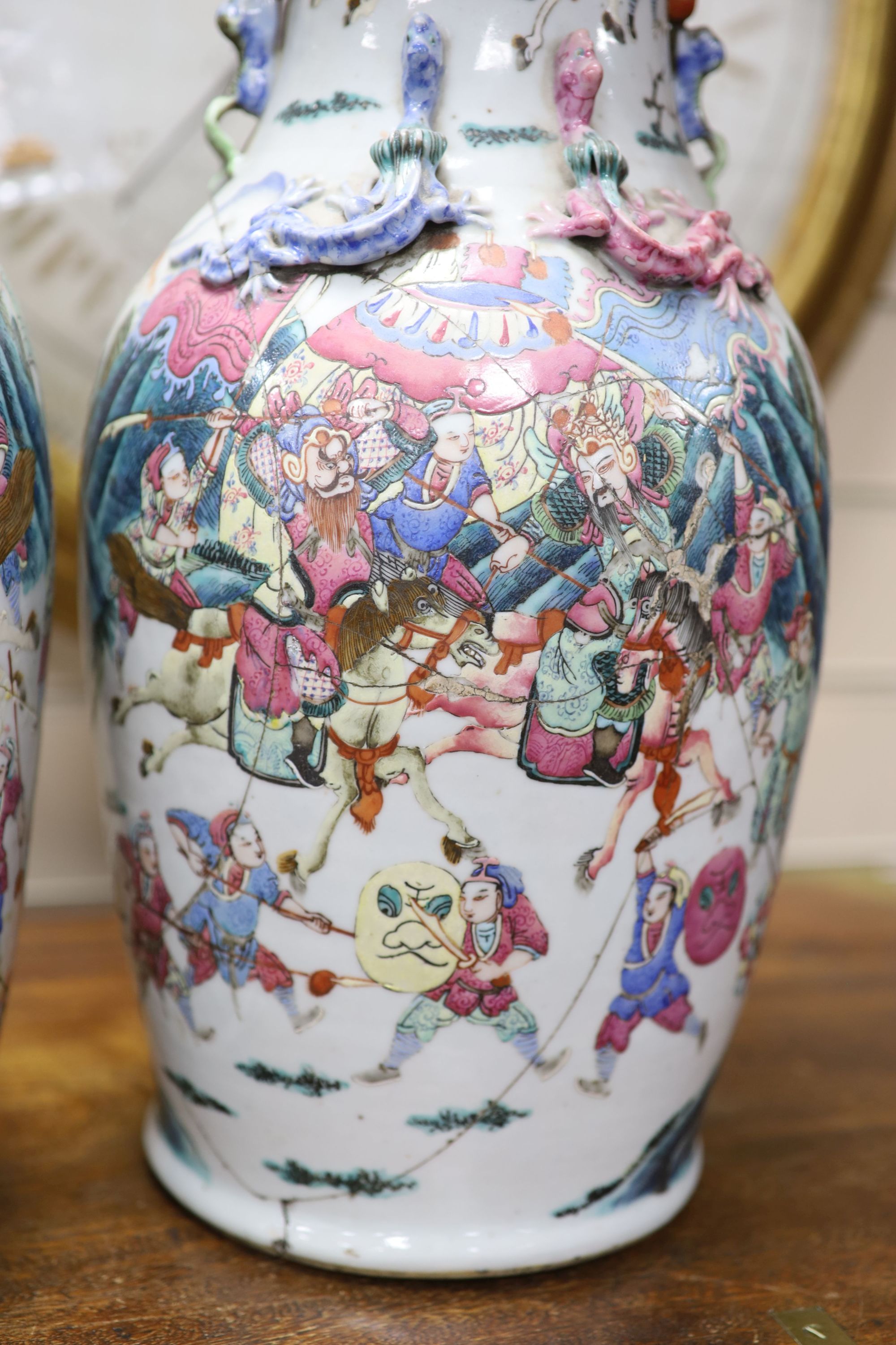 A pair of 19th century Chinese famille rose vases, height 46cm (a.f.)